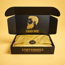 Open black box with gold interior and 'Chad Box' branding on a yellow background