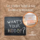 Promotional image for 'Stuffed Boxes' with a blackboard asking 'What's Your Hobby?' and a box labeled 'Hobby Explorer'.